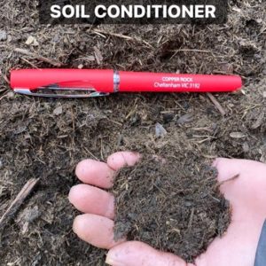 handful of organic compost soil conditioner mulch